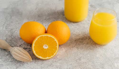 fresh oranges and juice