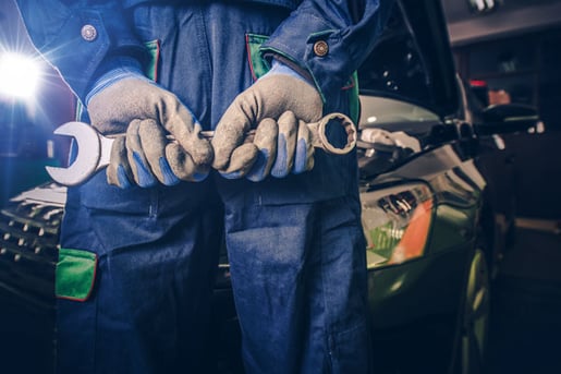 blog-mechanic-holding-wrench